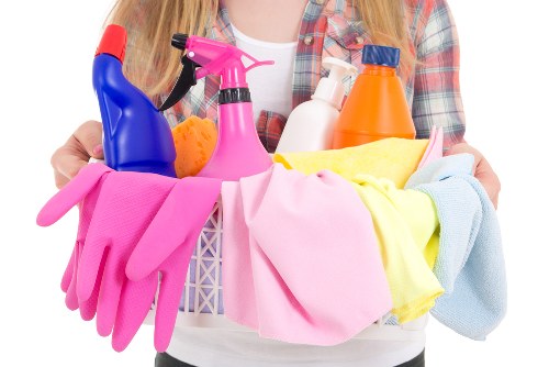 Carpet cleaner treating stains in a London flat living room