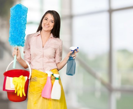 Cleaner using protective gloves while handling cleaning products
